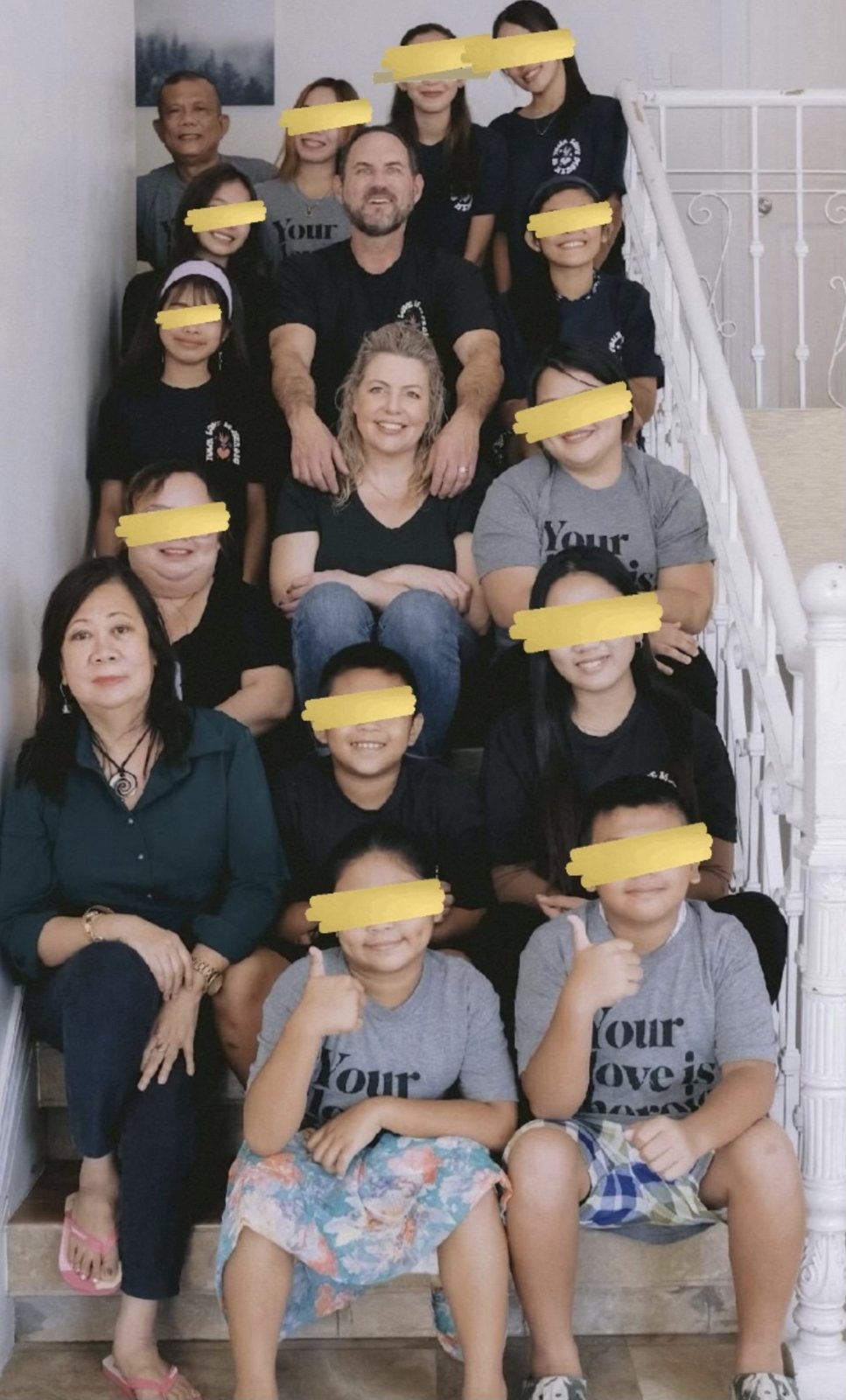The Promise House family on the stairs